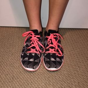 Black, White, and Pink Nike Tennis Shoes